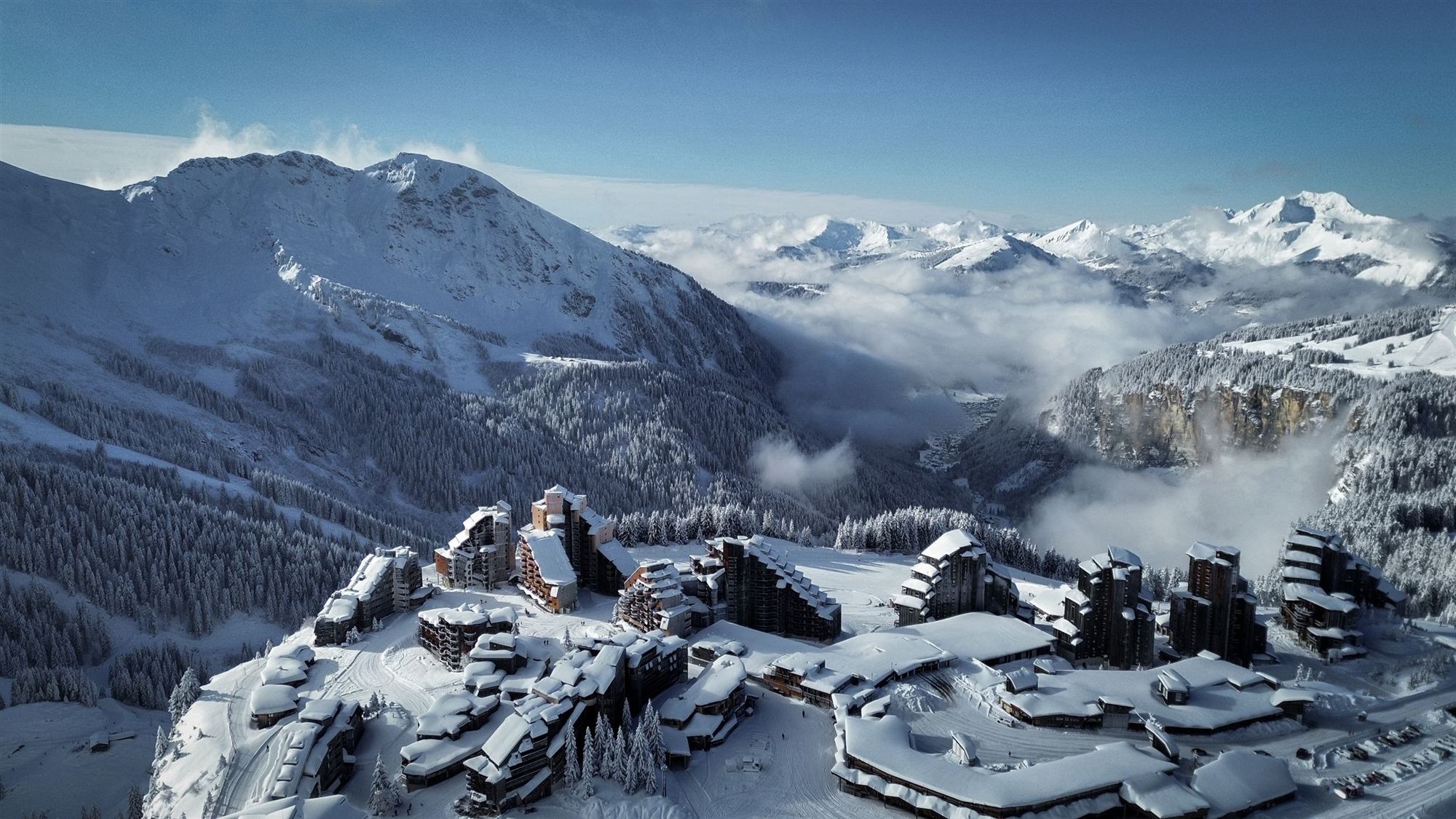 Aerial view of Avoriaz 1800 under snow, a sea of clouds over the valley
